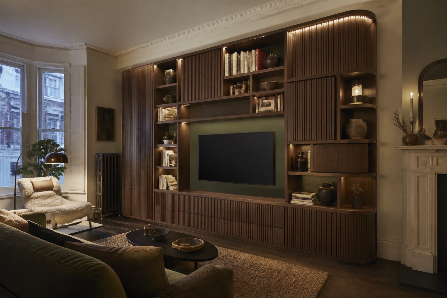 Illustrative concept of a smoked-oak media and library wall in a British period home